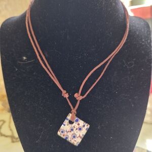 Adjustable cord necklace with glass tile pendent